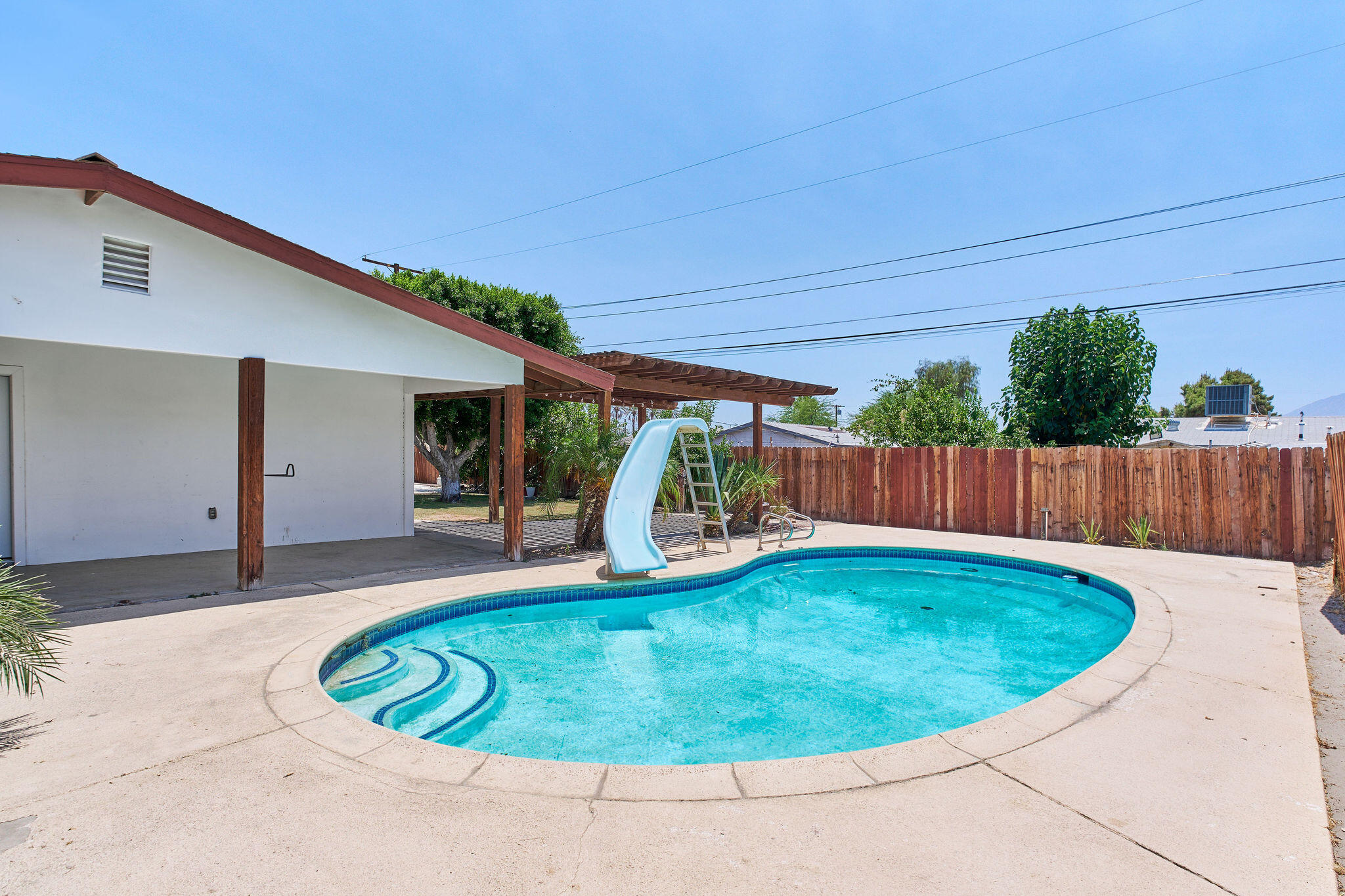 83175 Rue Paray Thermal, CA 92274 - Photo 13 of 44 a view of a house with swimming pool and porch