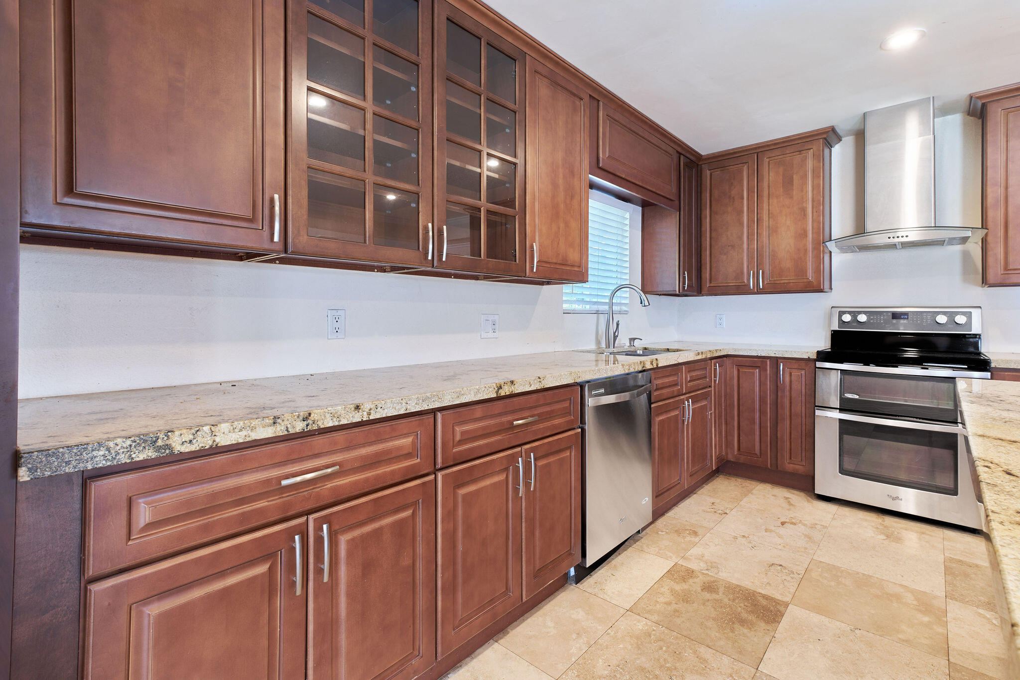 83175 Rue Paray Thermal, CA 92274 - Photo 18 of 44 a kitchen with stainless steel appliances granite countertop a stove and cabinets