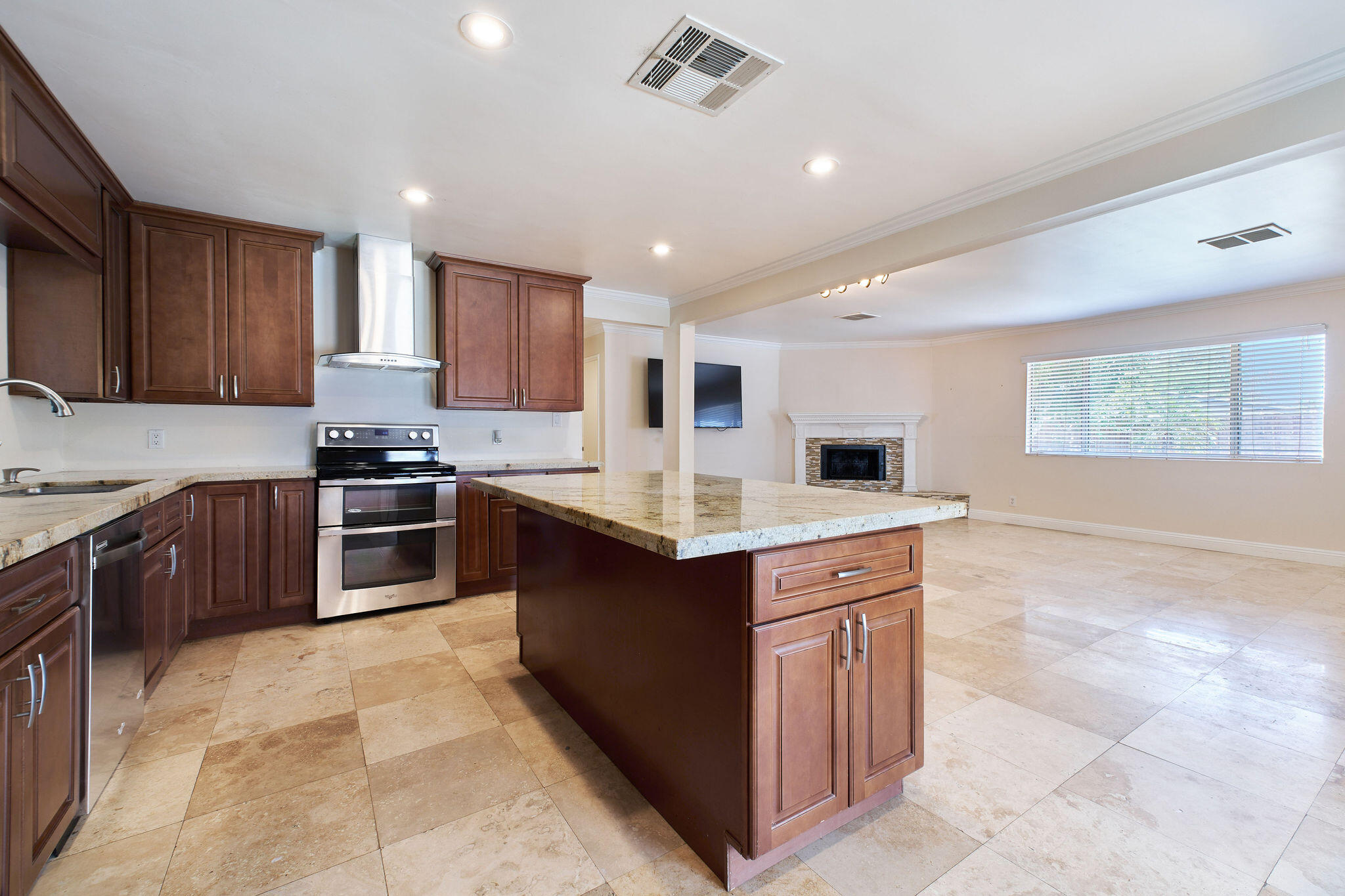 83175 Rue Paray Thermal, CA 92274 - Photo 19 of 44 a kitchen with stainless steel appliances granite countertop a stove top oven a sink a counter top space and cabinets