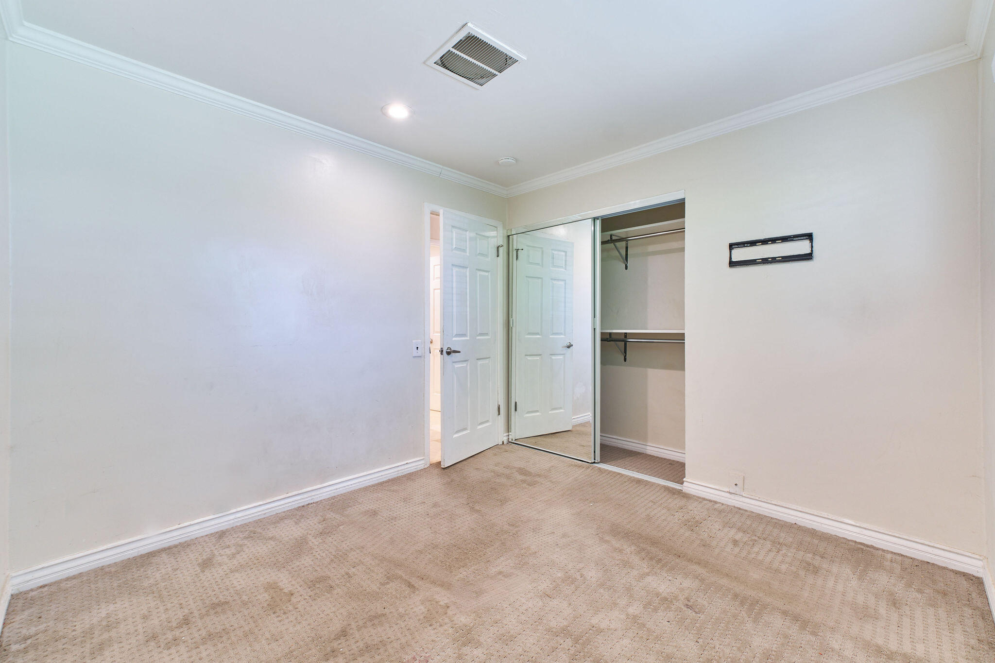 83175 Rue Paray Thermal, CA 92274 - Photo 22 of 44 an empty room with a cabinet and a window