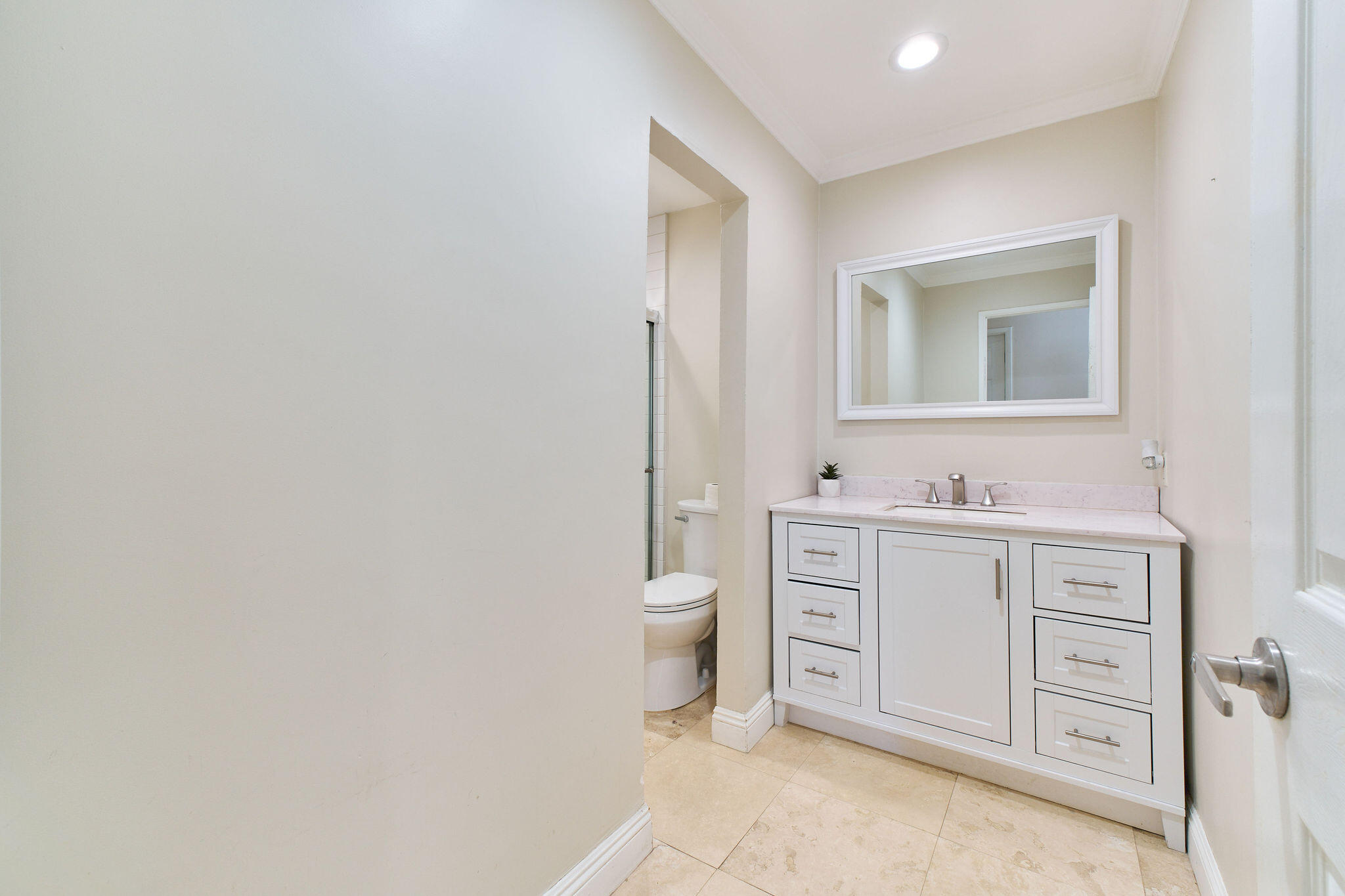 83175 Rue Paray Thermal, CA 92274 - Photo 24 of 44 a spacious bathroom with a toilet a sink and mirror