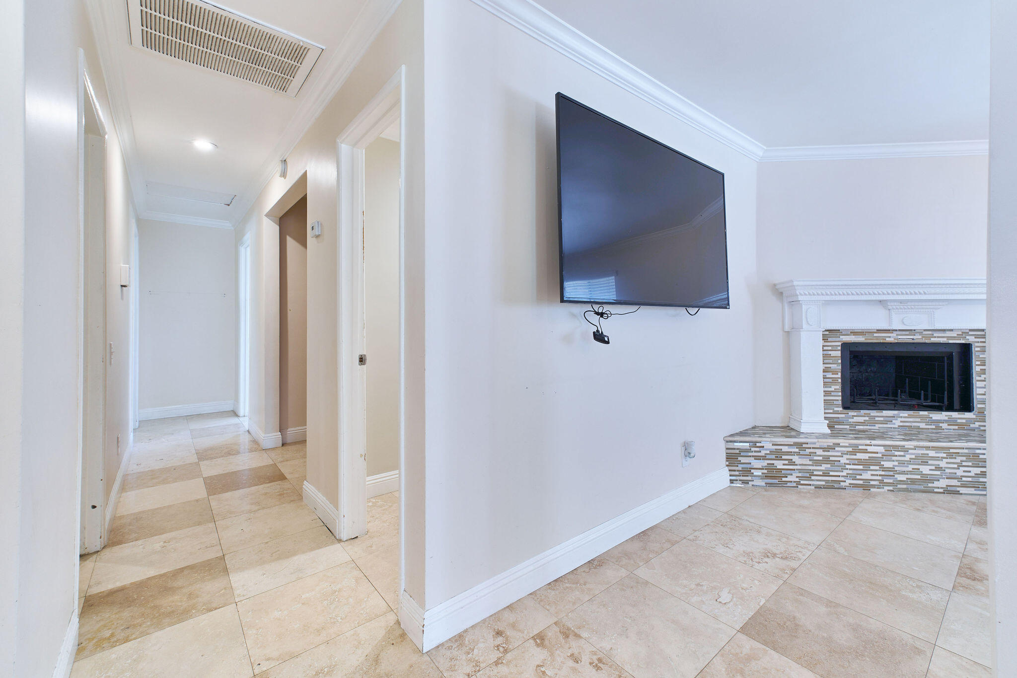 83175 Rue Paray Thermal, CA 92274 - Photo 41 of 44 a view of living room with a flat screen tv and a fireplace