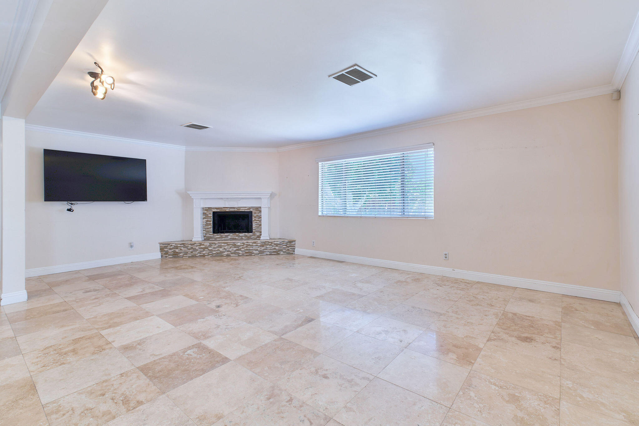 83175 Rue Paray Thermal, CA 92274 - Photo 43 of 44 a living room with a flat screen tv and a fireplace