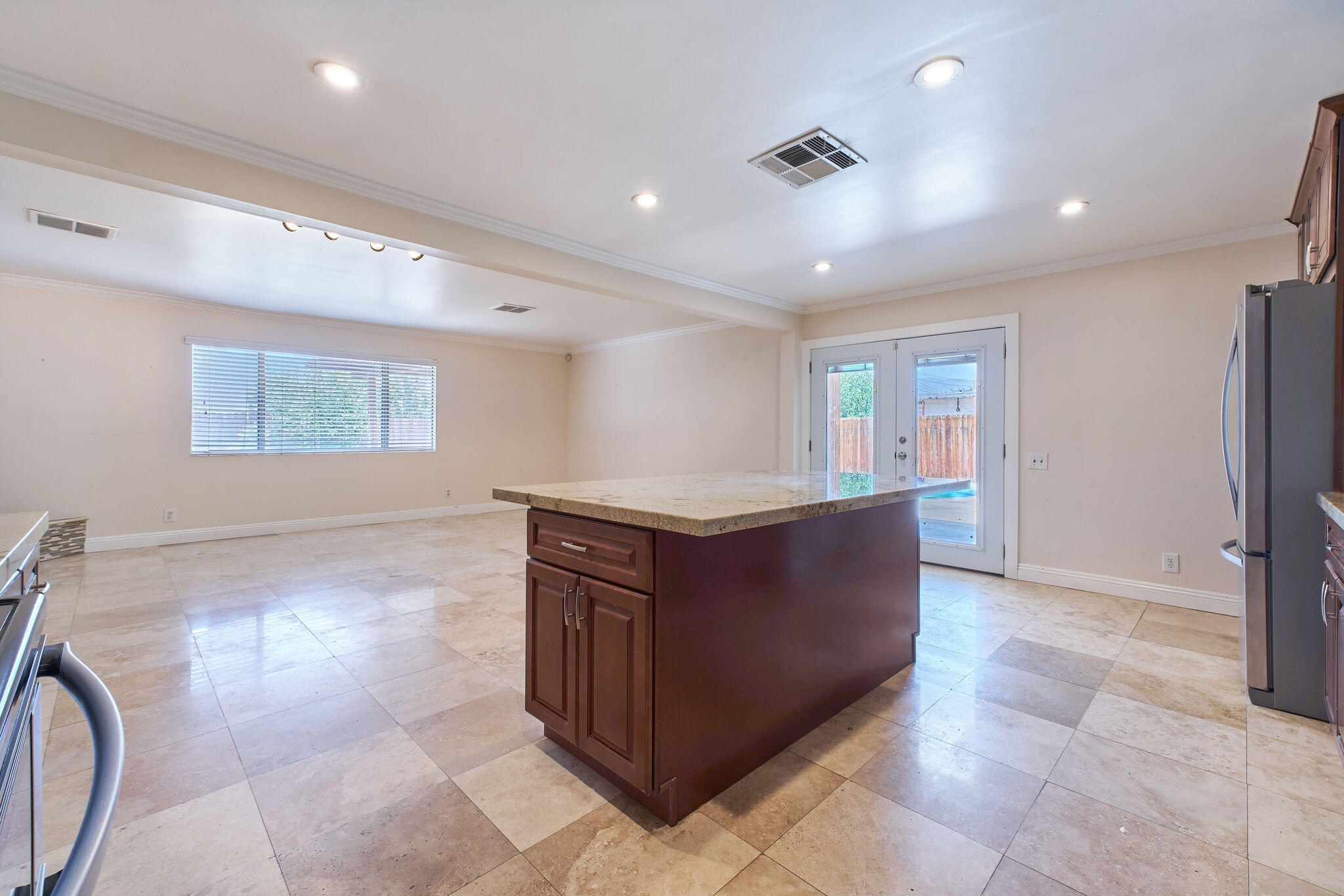 83175 Rue Paray Thermal, CA 92274 - Photo 9 of 44 a kitchen with stainless steel appliances granite countertop a refrigerator and a sink