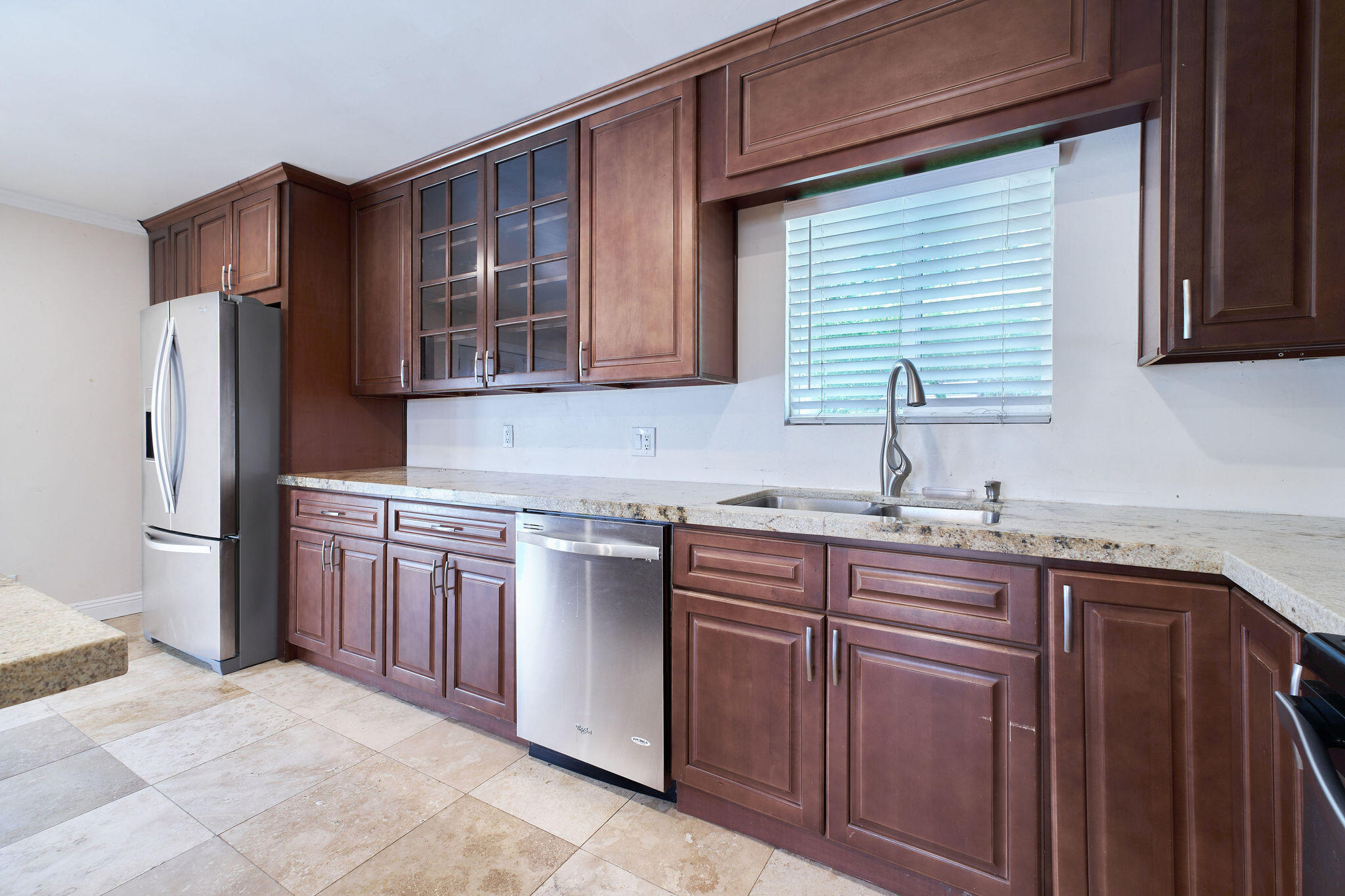 83175 Rue Paray Thermal, CA 92274 - Photo 10 of 44 a kitchen with stainless steel appliances granite countertop a sink stove and refrigerator