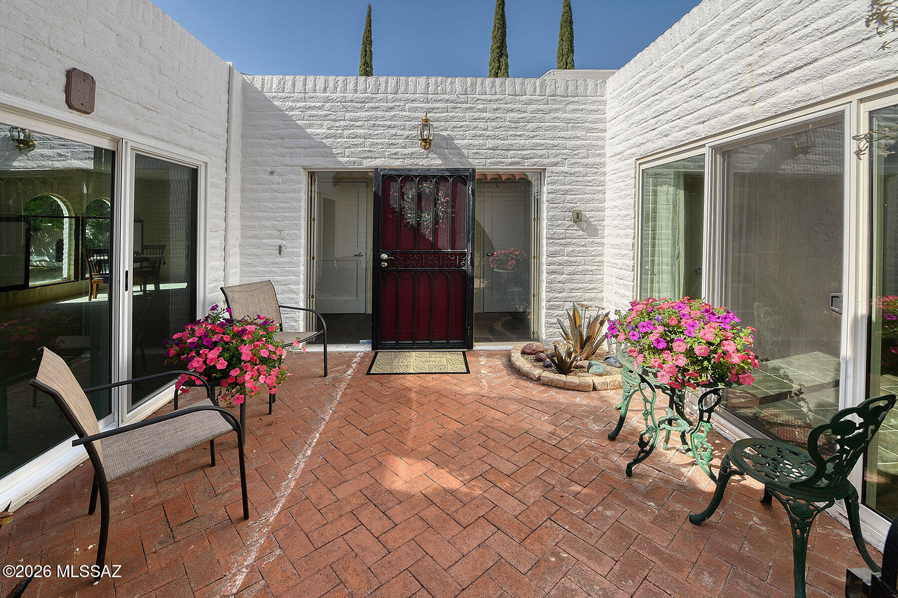719 West Las Lomitas Road Tucson, AZ 85704 - Photo 7 of 44 a lobby with a flower table and chairs