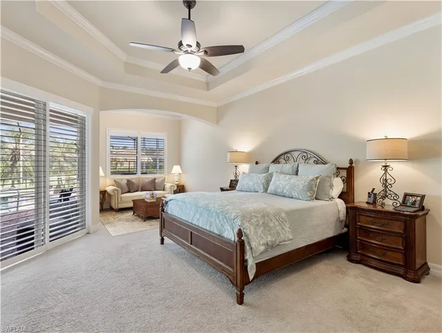 a bedroom with a bed and a couch