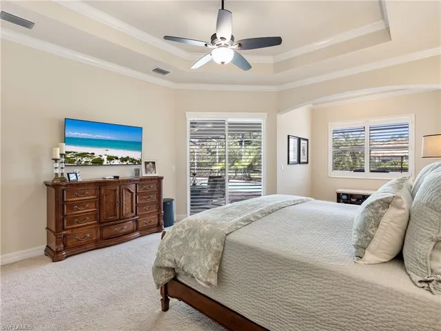 a bedroom with a bed dresser and a window