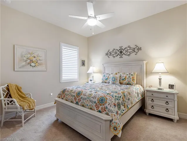 a bedroom with a bed and a chair