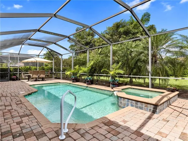 a view of a swimming pool with a patio