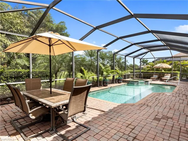 a view of swimming pool with outdoor seating