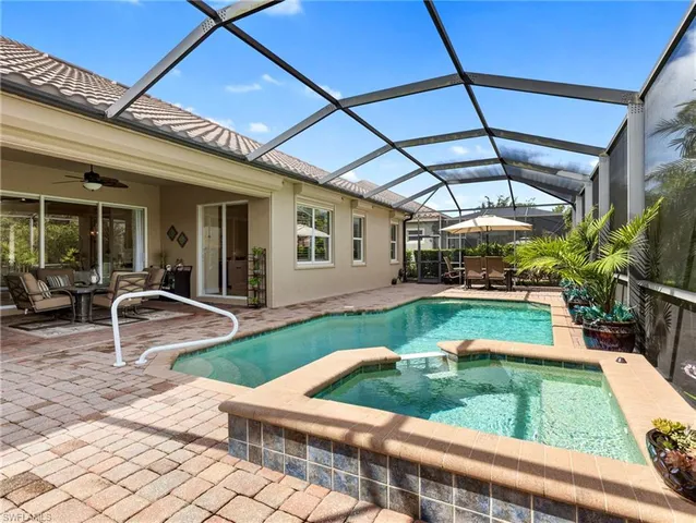 a view of a backyard with sitting area