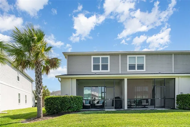a view of house with outdoor space and swimming pool