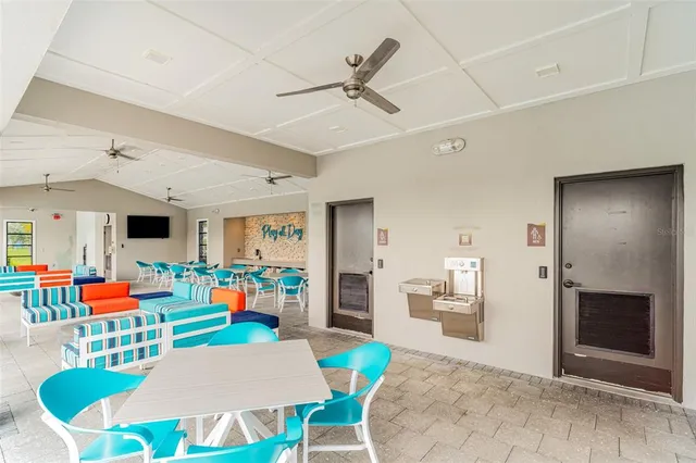 a room with gym equipment and a view of living room