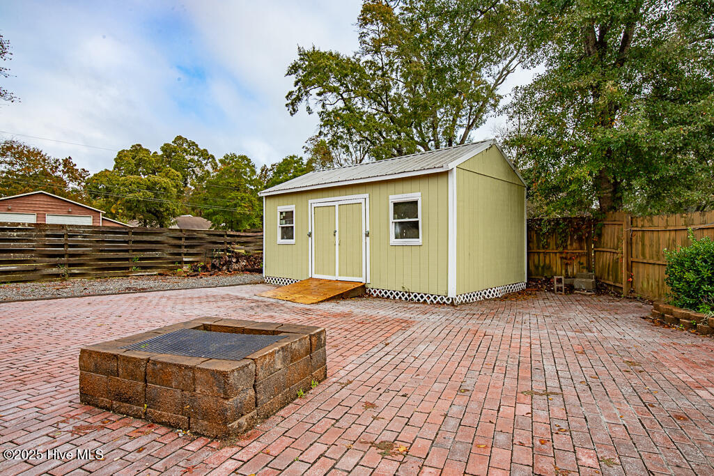 103 Quail Ridge Road Havelock, NC 28532 - Photo 21 of 24 Storage Building and Fire Pit