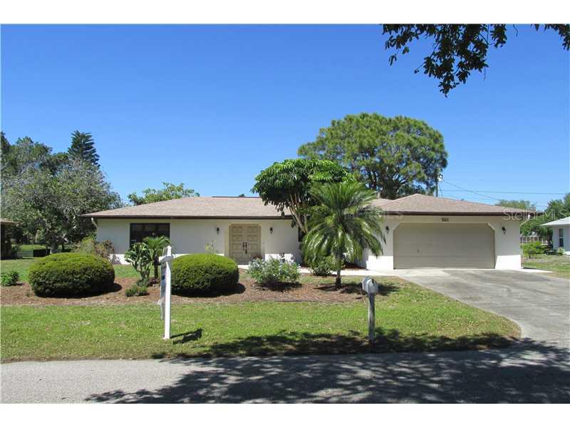 965 Shasta Road Venice, FL 34293 - Photo 1 of 1 a view of a yard in front of a house with plants and large tree
