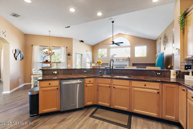 a large kitchen with a lot of counter space and a sink