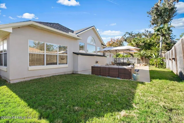 a view of a house with a yard and plants