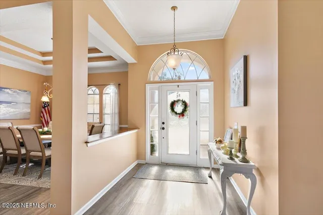 a view of a livingroom with furniture window and wooden floor