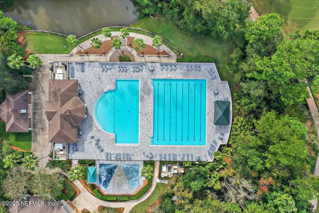 an aerial view of a house with a garden