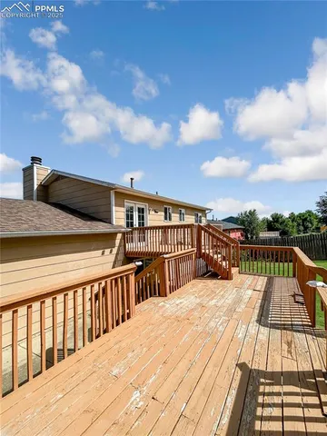 a view of balcony with wooden floor