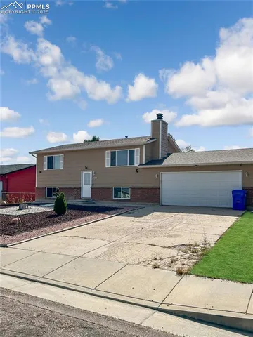 a view of a house with snow on the road