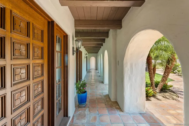 a living room with furniture a fireplace and a table