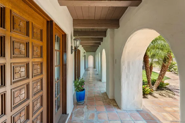 a living room with furniture a fireplace and a table