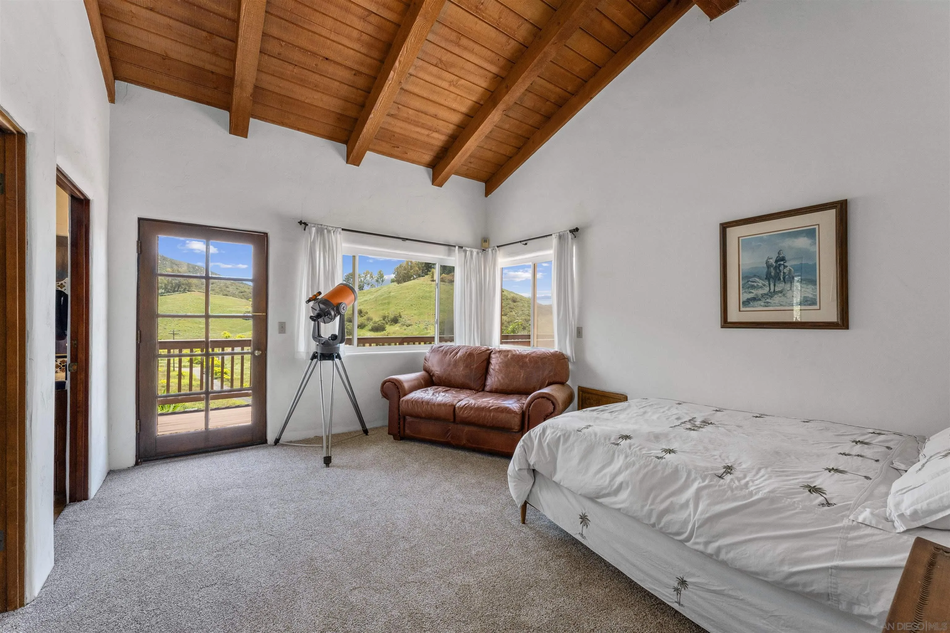 17156 Dos Hermanos Road Poway, CA 92064 - Photo 52 of 70 a bedroom with a bed and a couch