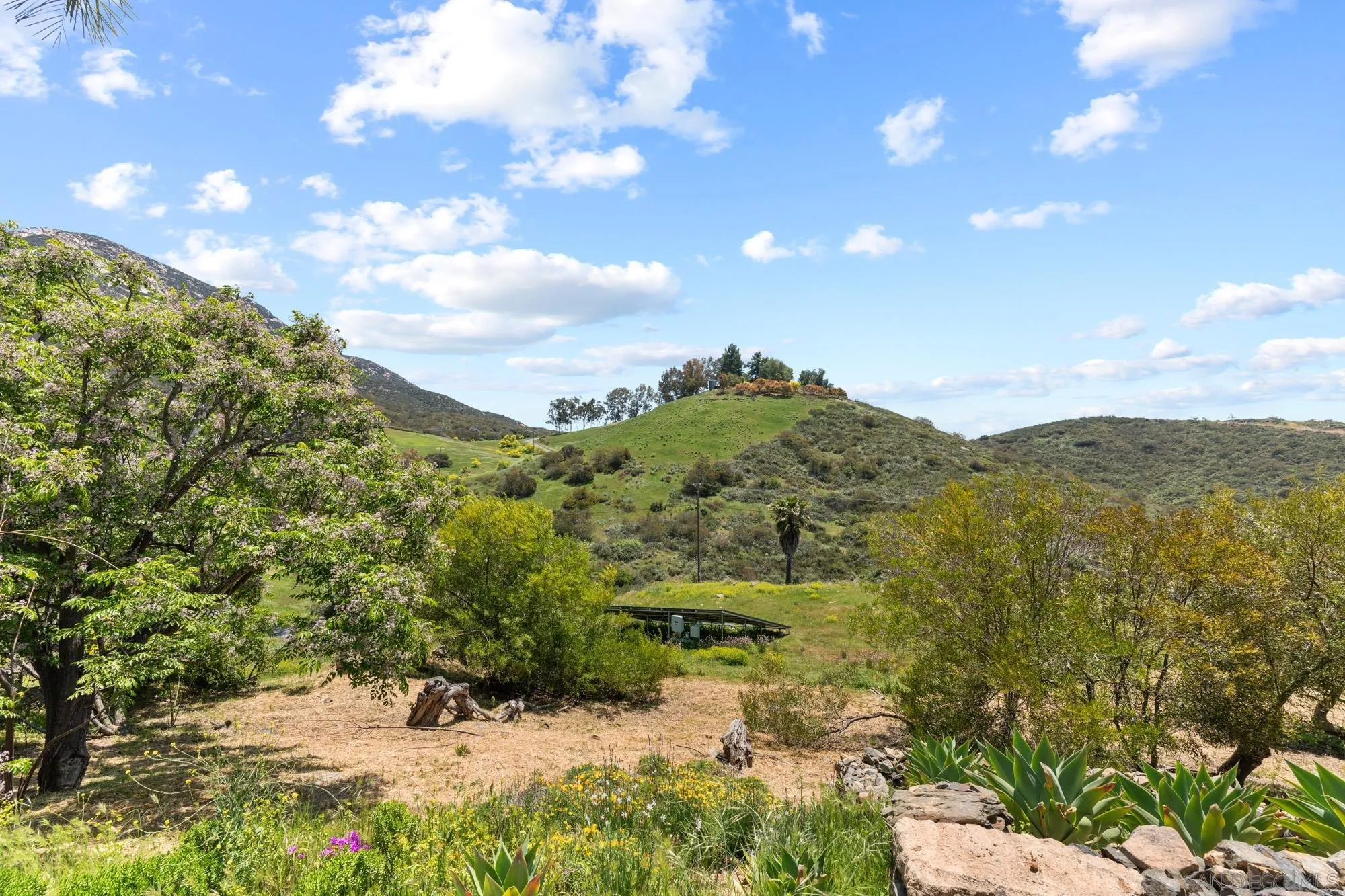 17156 Dos Hermanos Road Poway, CA 92064 - Photo 57 of 70 a view of a bunch of mountains in between of two buildings