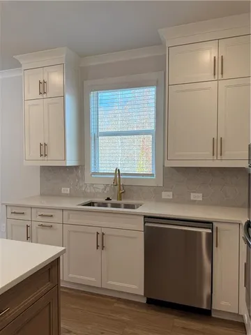 a view of a hallway with wooden floor and windows