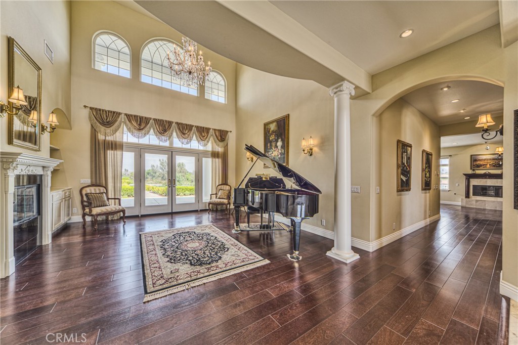 39700 Berenda Road Temecula, CA 92591 - Photo 11 of 71 a living room with furniture and a floor to ceiling window or wooden floor