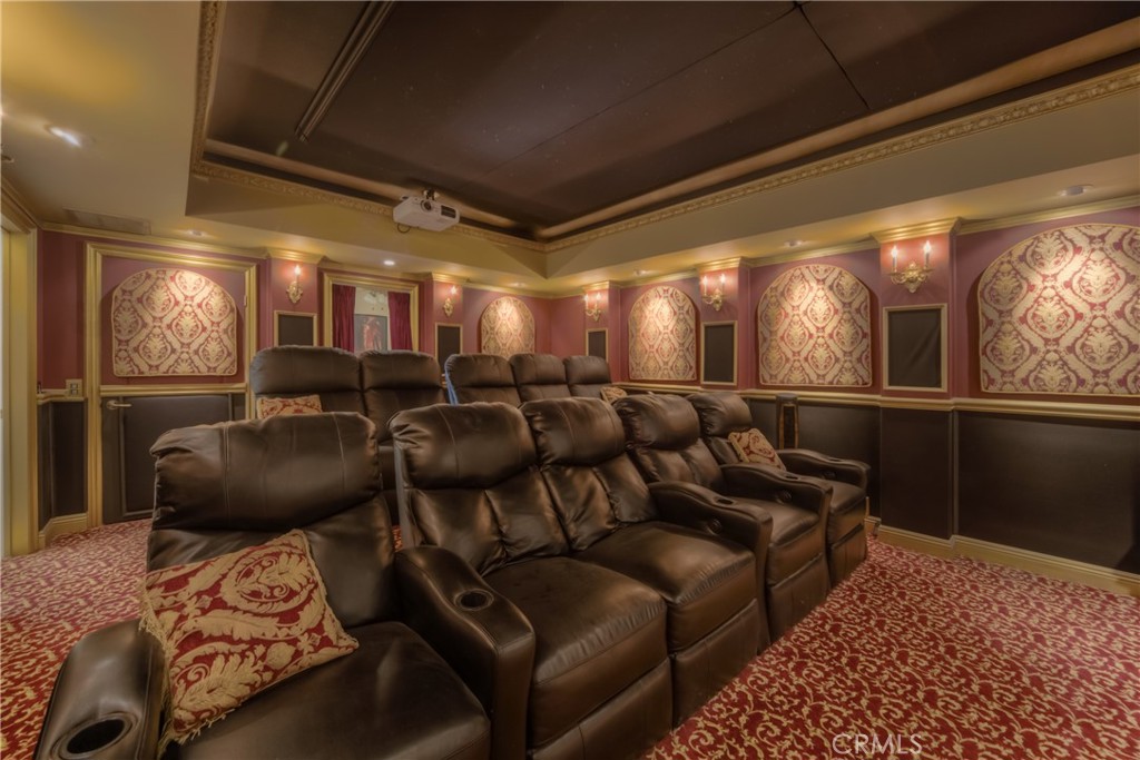 39700 Berenda Road Temecula, CA 92591 - Photo 30 of 71 a media room with lots of chairs and a chandelier