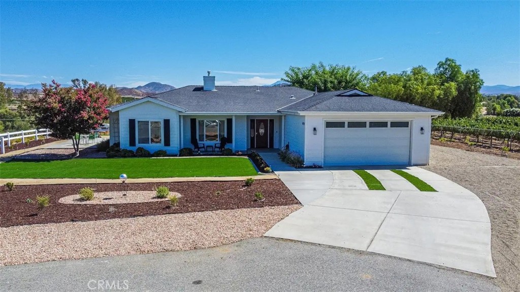 39700 Berenda Road Temecula, CA 92591 - Photo 4 of 71 a front view of house with yard and green space