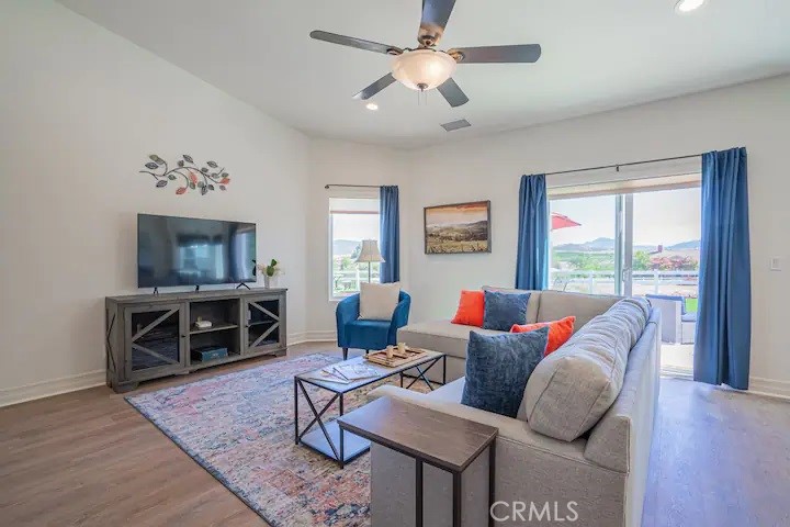 39700 Berenda Road Temecula, CA 92591 - Photo 55 of 71 a living room with furniture a flat screen tv and a window