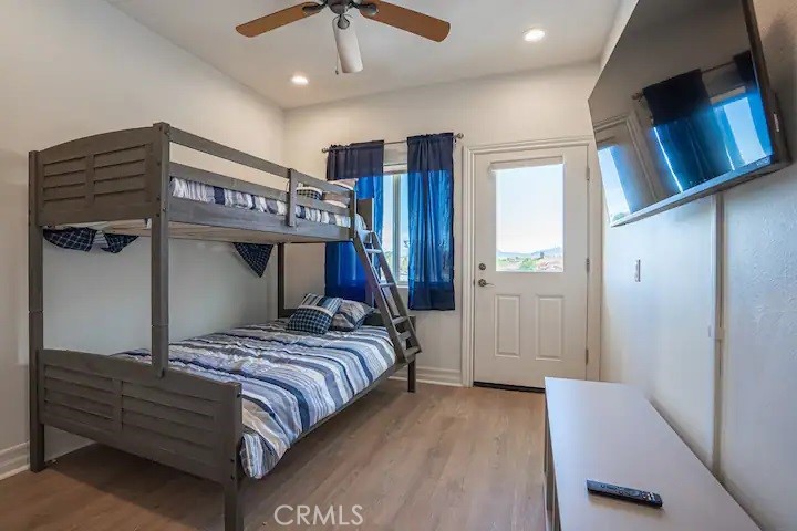 39700 Berenda Road Temecula, CA 92591 - Photo 61 of 71 a bedroom with a large bed and a tv