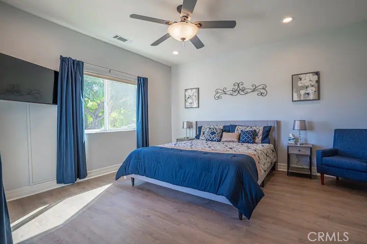 39700 Berenda Road Temecula, CA 92591 - Photo 63 of 71 a bedroom with a bed and a ceiling fan