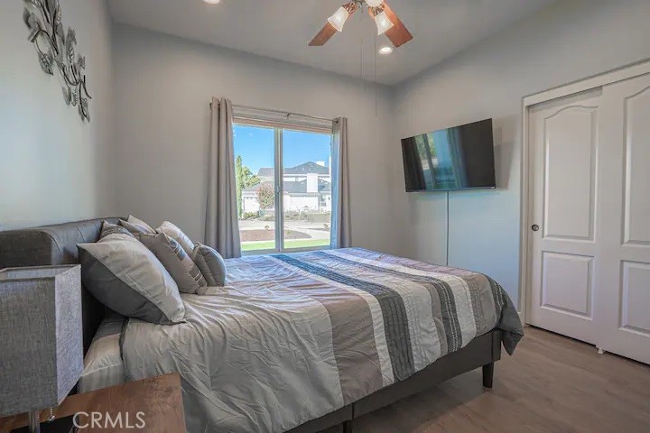 39700 Berenda Road Temecula, CA 92591 - Photo 65 of 71 a bedroom with a bed and flat screen tv