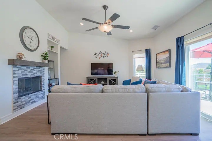 39700 Berenda Road Temecula, CA 92591 - Photo 67 of 71 a living room with furniture a fireplace and a large window