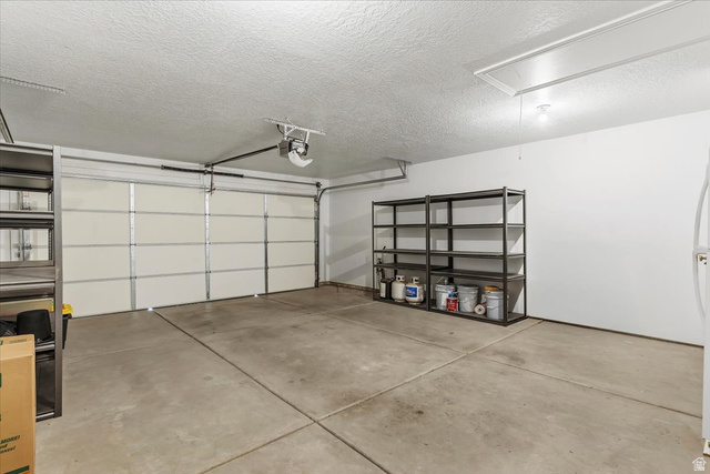 2028 West Grace Way Layton, UT 84041 - Photo 26 of 36 Garage with a garage door opener