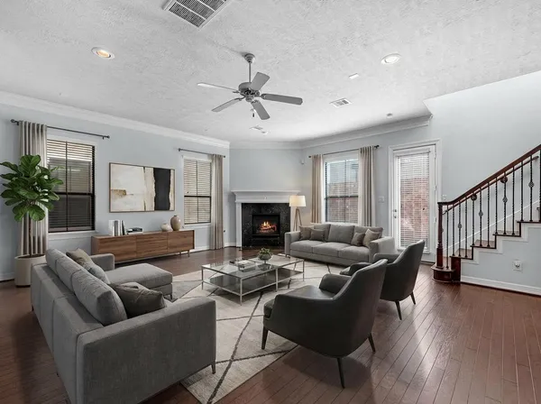 a living room with furniture and a fireplace