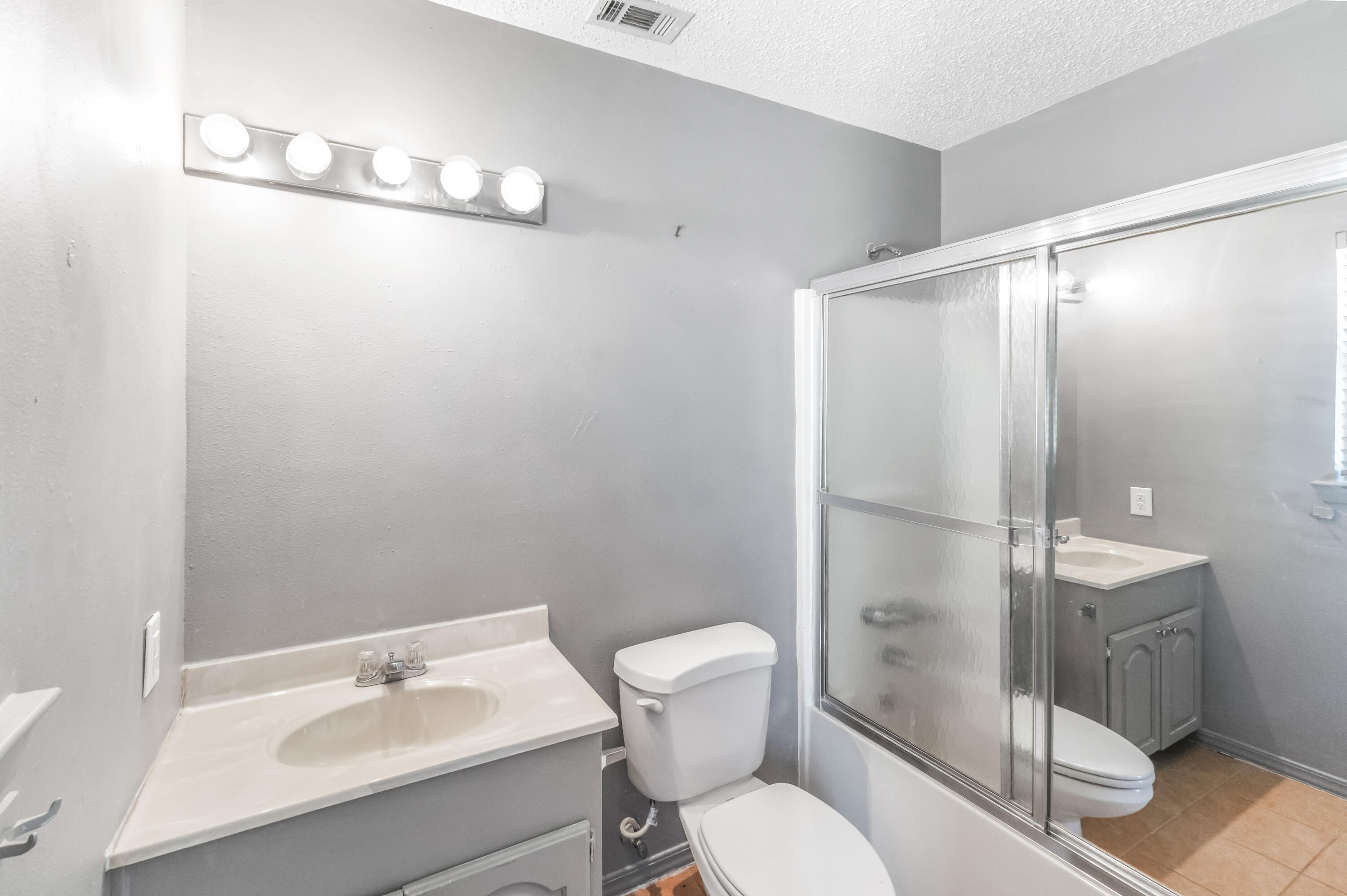 353 Florence Drive DeFuniak Springs, FL 32433 - Photo 11 of 16 a bathroom with a sink toilet and shower