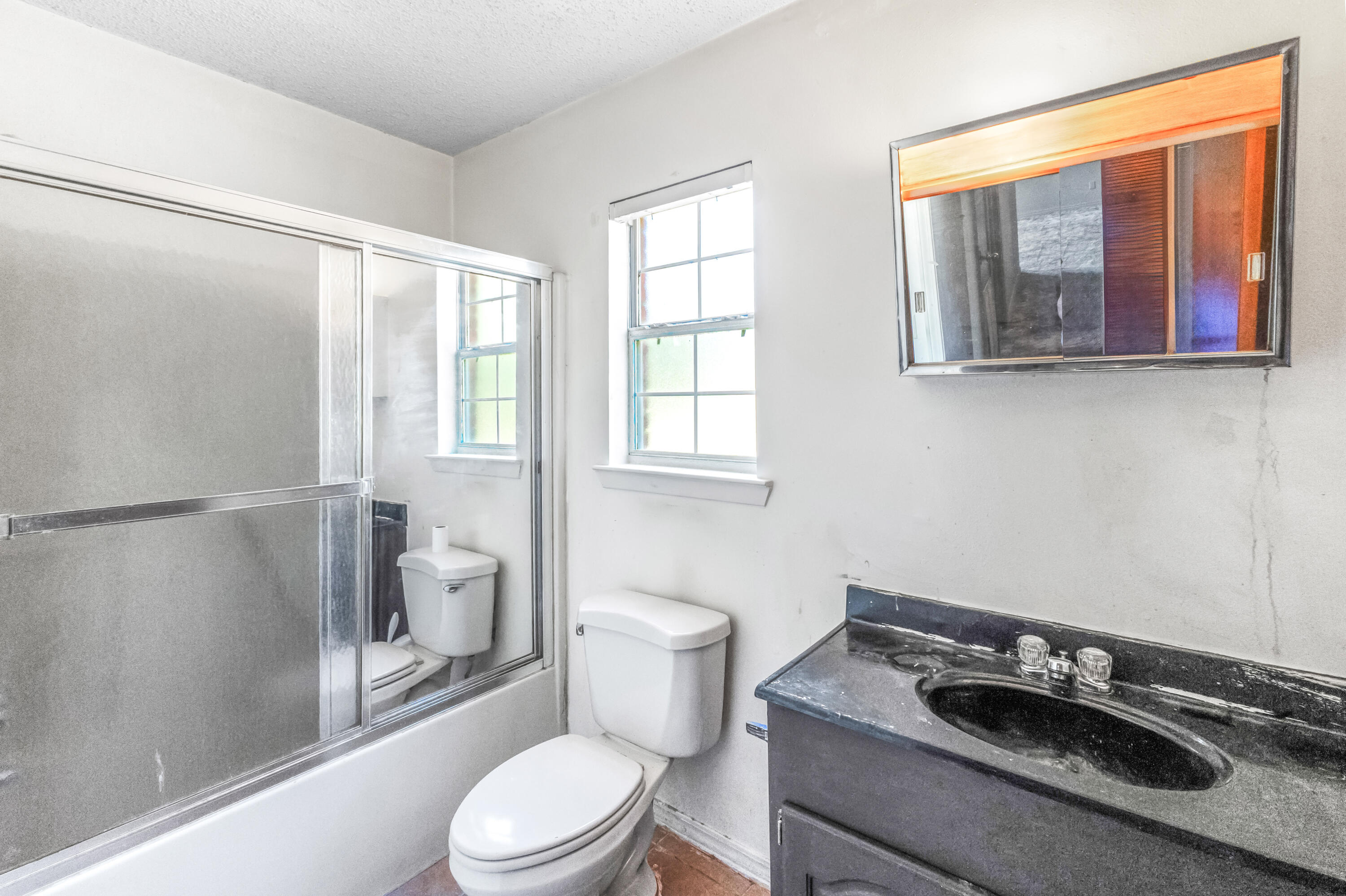 353 Florence Drive DeFuniak Springs, FL 32433 - Photo 12 of 16 a bathroom with a toilet sink and shower