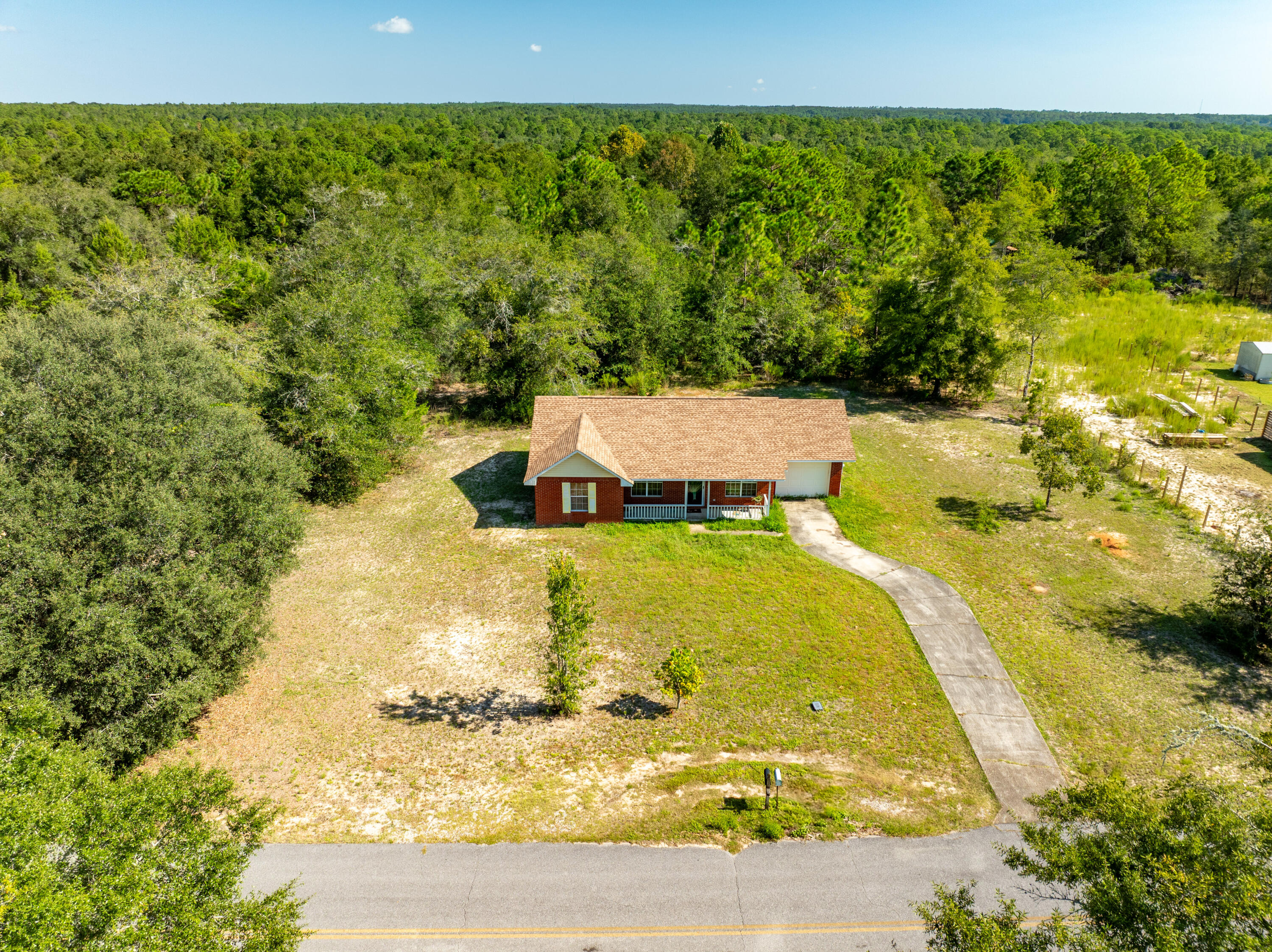 353 Florence Drive DeFuniak Springs, FL 32433 - Photo 15 of 16 a view of a swimming pool with an outdoor seating area