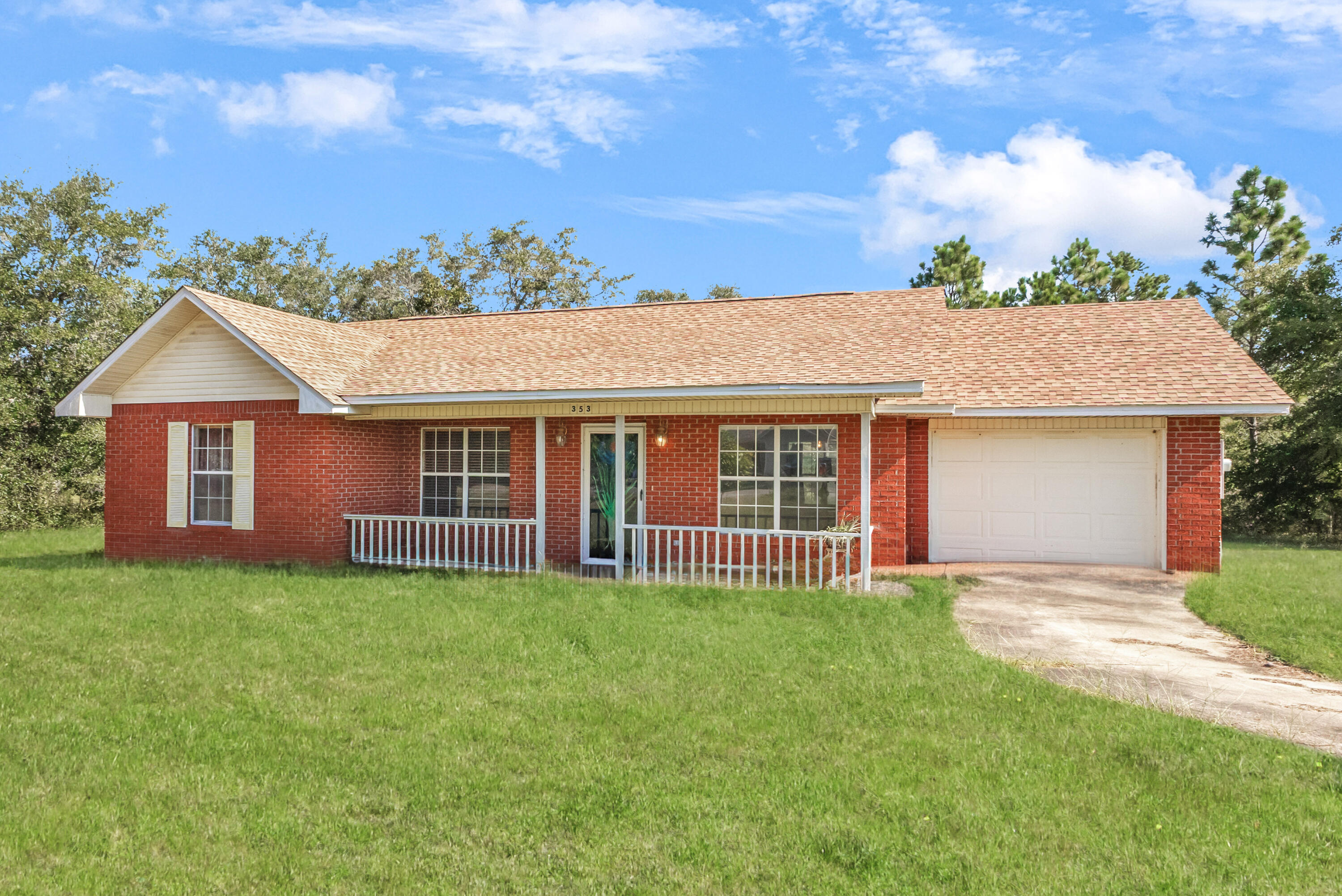 353 Florence Drive DeFuniak Springs, FL 32433 - Photo 2 of 16 front view of a house with a yard