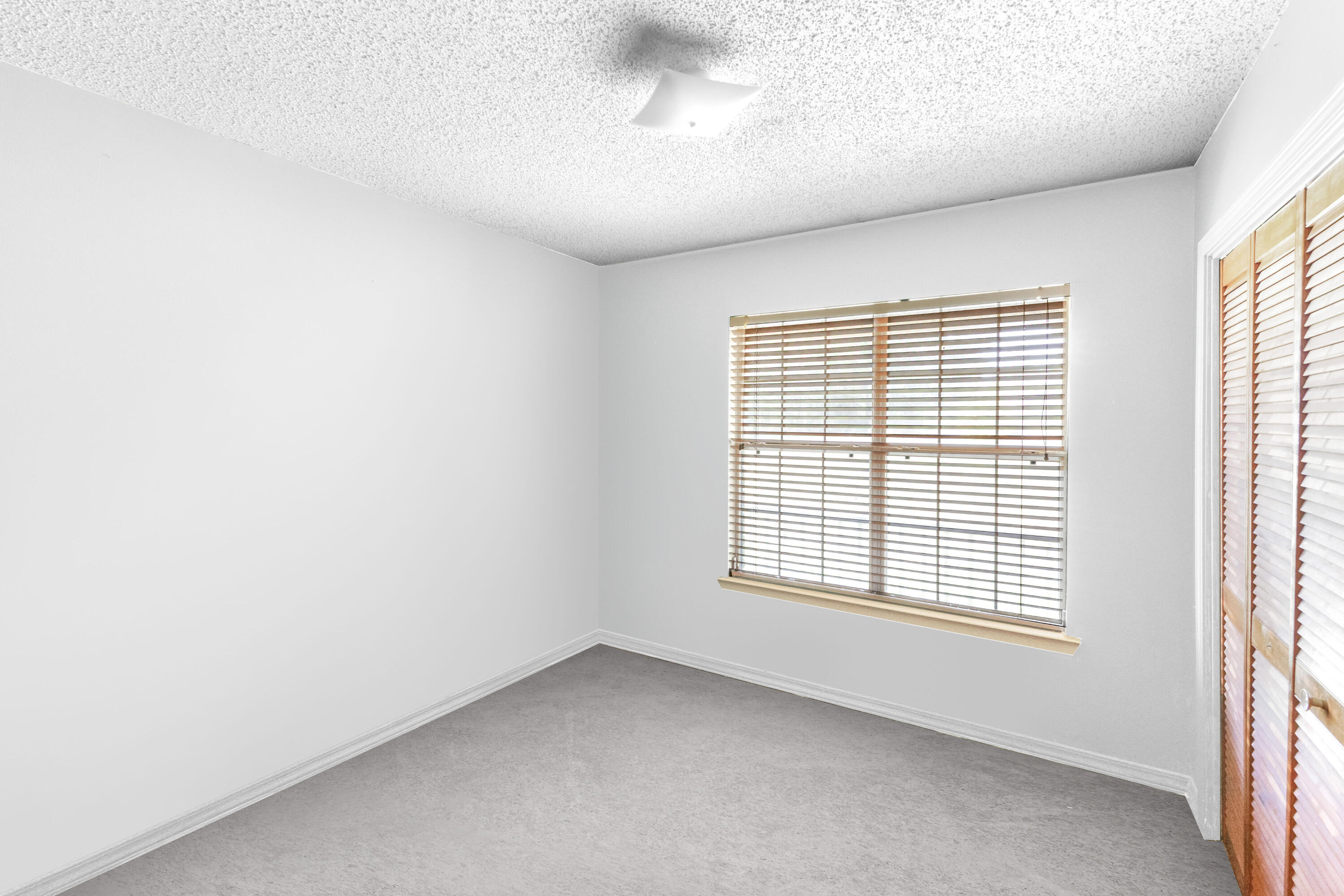353 Florence Drive DeFuniak Springs, FL 32433 - Photo 7 of 16 a view of an empty room with a window