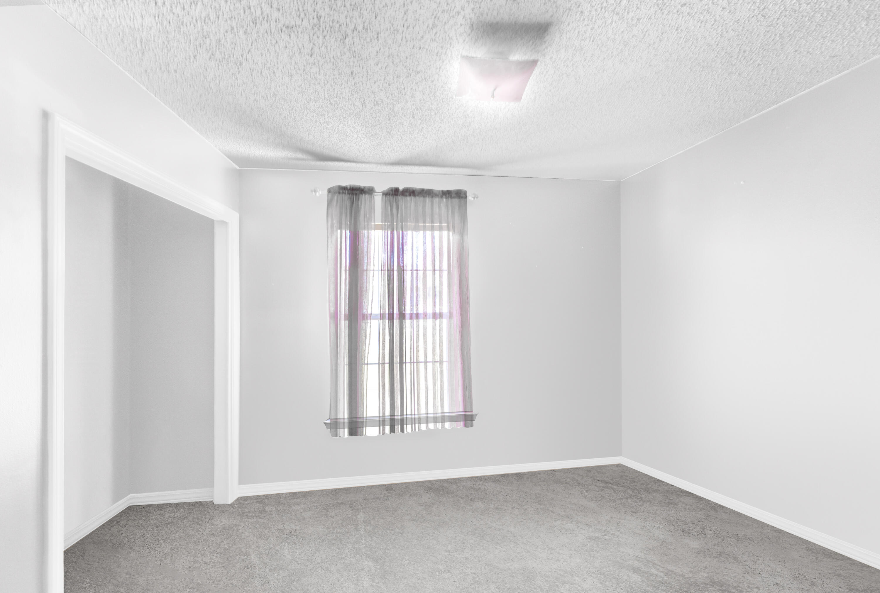 353 Florence Drive DeFuniak Springs, FL 32433 - Photo 9 of 16 an empty room with a empty space and windows