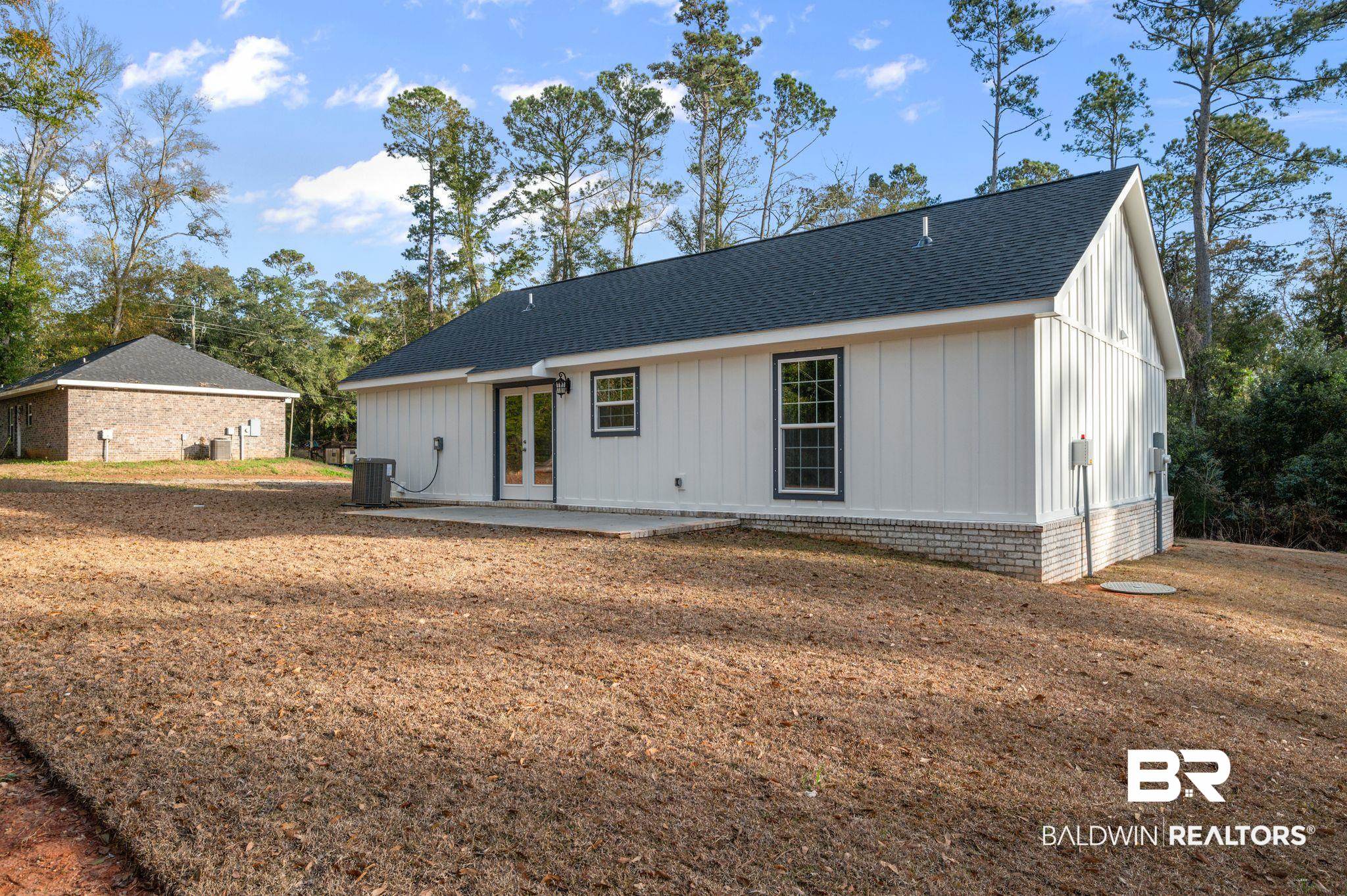 1473 Pollard Road Daphne, AL 36526 - Photo 30 of 32 Rear view of property featuring a patio area and central air condition unit