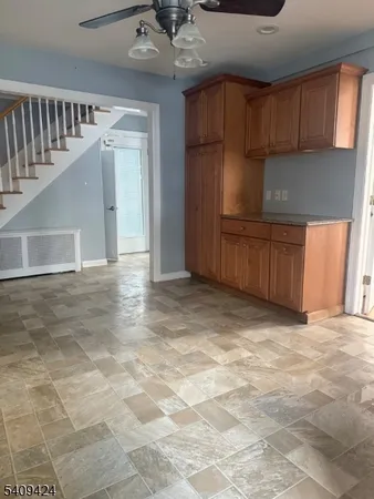 a view of a kitchen with a sink and cabinets