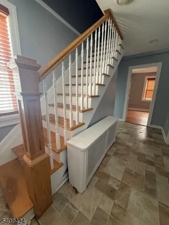 a view of entryway with wooden floor